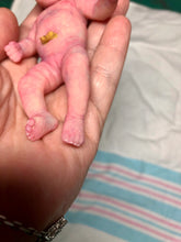 Load image into Gallery viewer, Prototype full body silicone mini baby Milly 4.5” in super soft blend asleep bald with belly button stamp