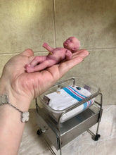 Load image into Gallery viewer, Prototype full body silicone mini baby Milly 4.5” in super soft blend asleep bald with belly button stamp
