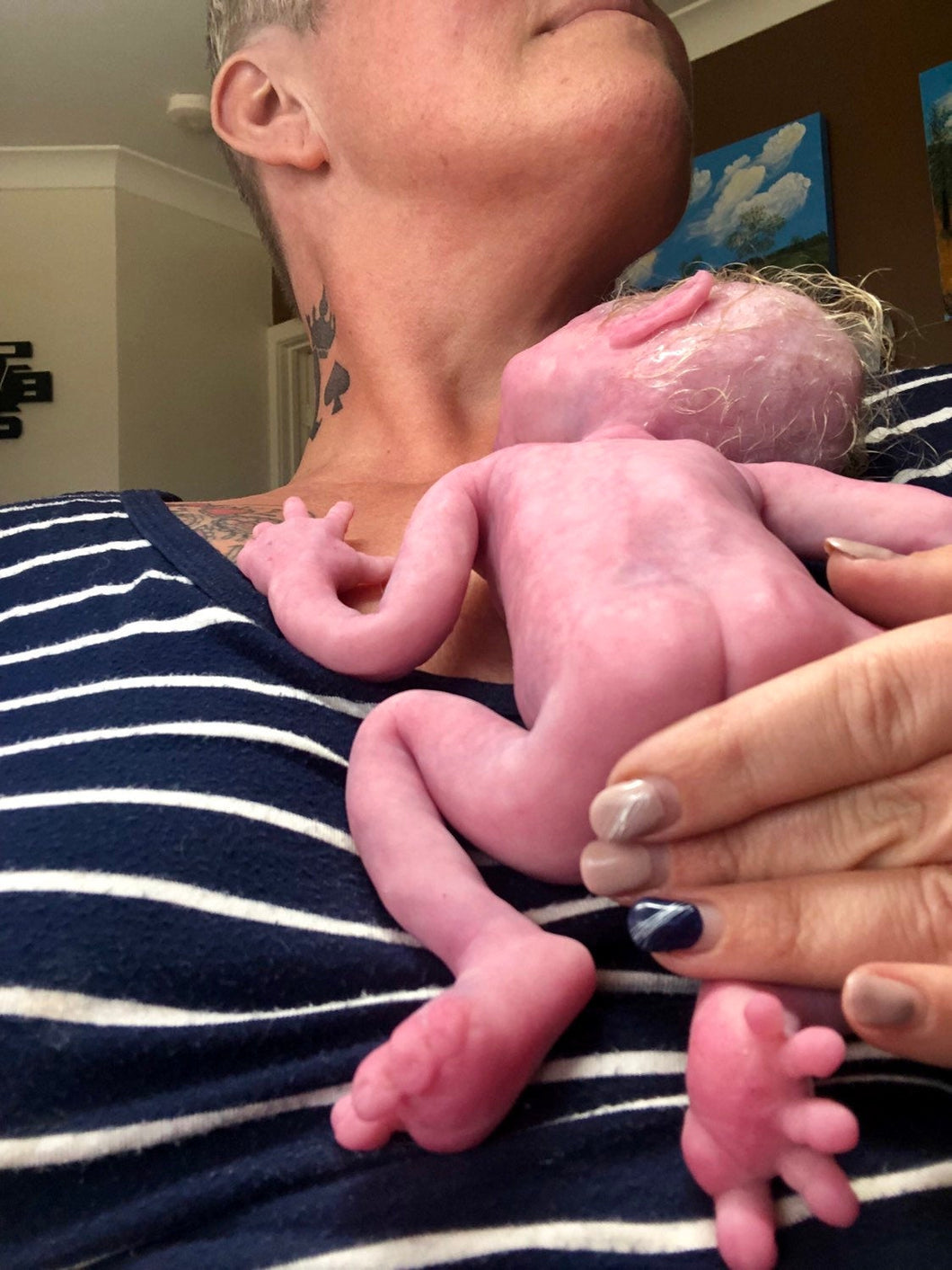 Full body silicone premature baby in soft blend rooted with blonde hair