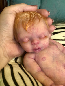 AVAILABLE Prototype full body silicone kit Prada 11.5” (baby girl) in super soft blend asleep in  super soft platinum silicone